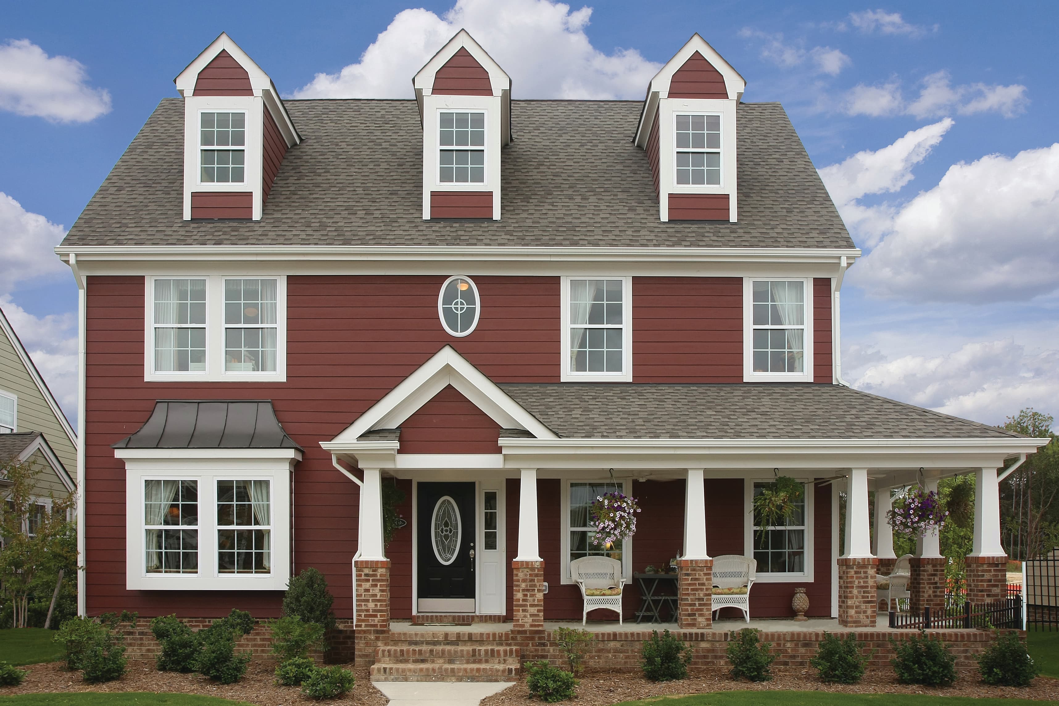 Different Styles and Colors - Colonial house clad in Hardie® Plank Lap in custom red Colonial house clad in Hardie® Plank Lap in custom red