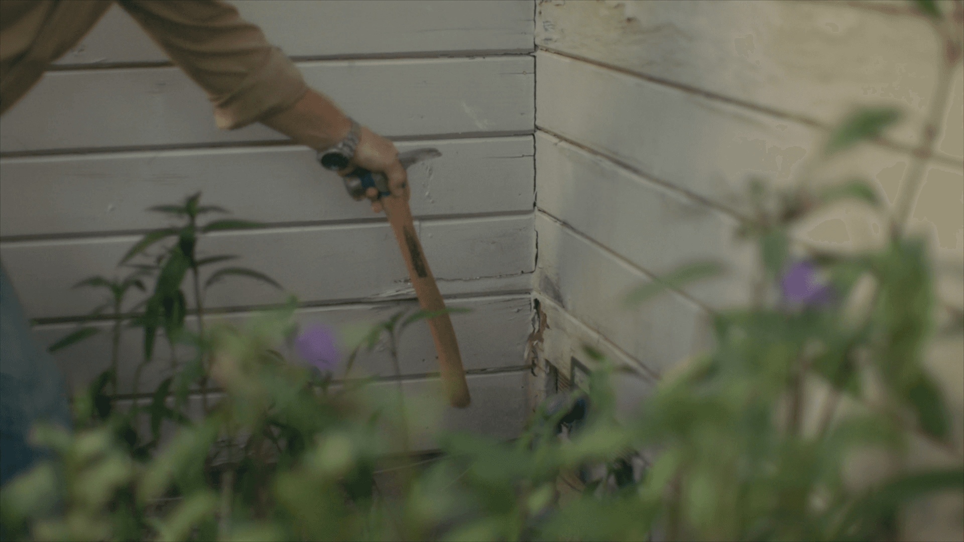 Decide to Re-side: Chip Gaines pointing out cracked, water damaged siding Chip Gaines pointing out cracked, water damaged siding
