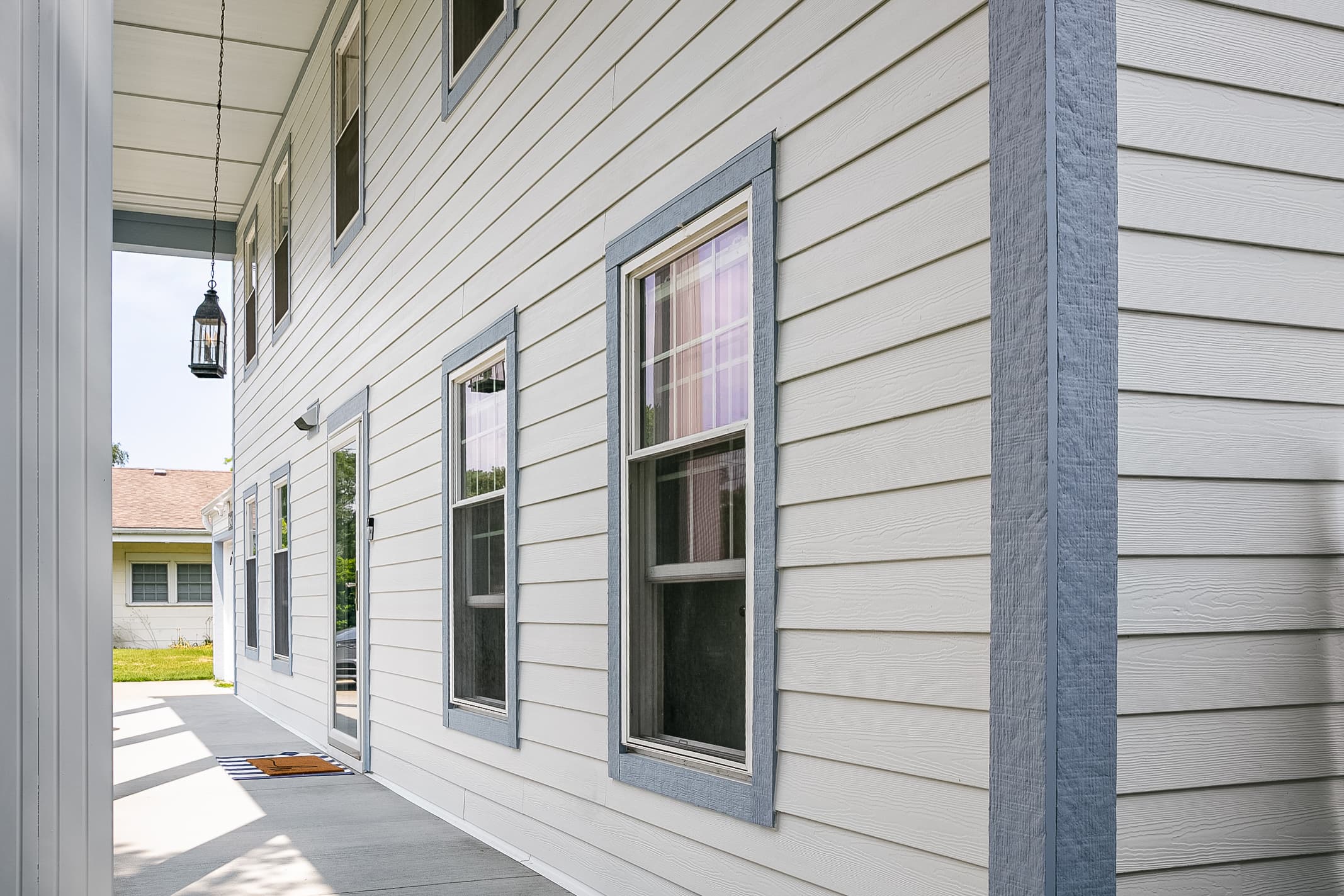 Selecting siding and trim for a whole house re-side: detail of a house corner clad with Breezy Coastal colored Hardie Trim Detail of a house corner clad with Breezy Coastal colored Hardie Trim