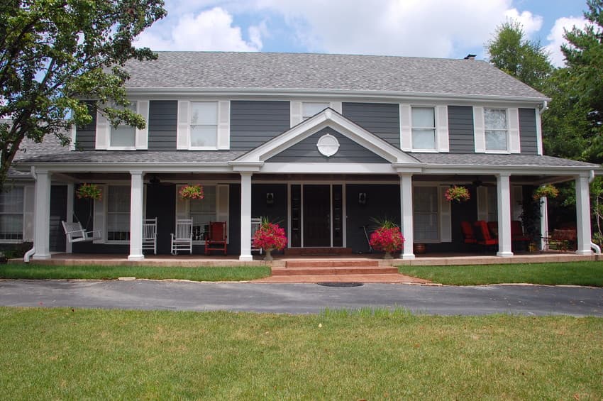 re-side-your-home Home with gray lap siding and white shutters.